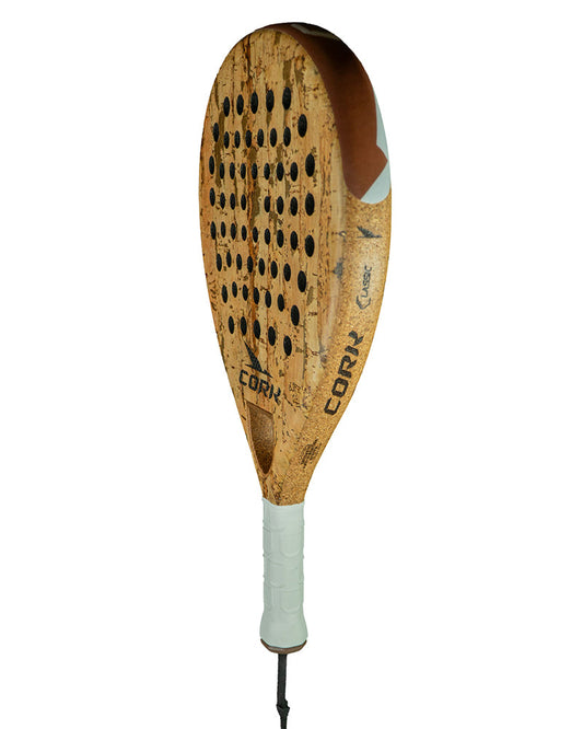 Wooden paddle with cork texture on a white background
