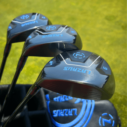 Close-up of golf club heads with 'Lazarus' branding on a grass background