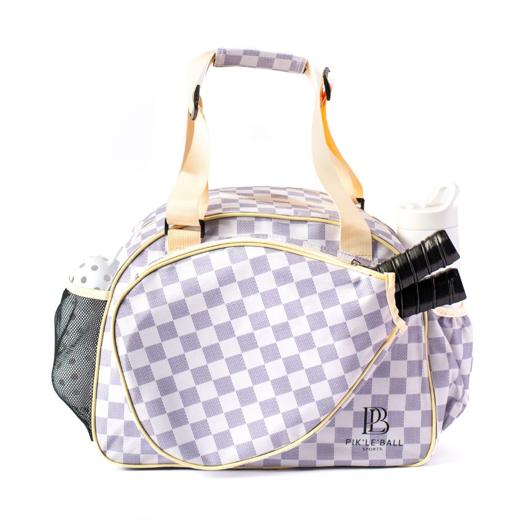 Checkered pickleball bag with paddle and balls on a white background
