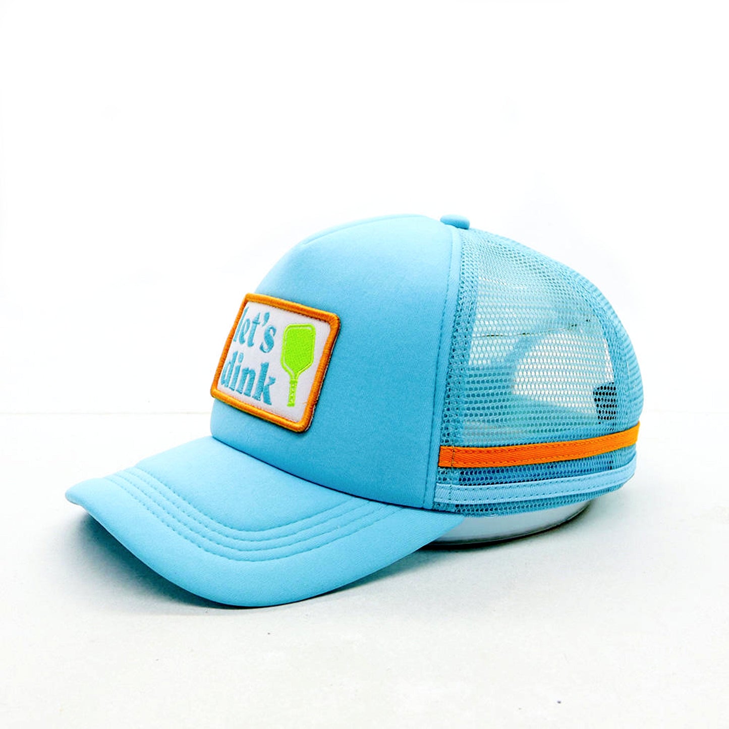 Light blue cap with a patch and orange band on a white background