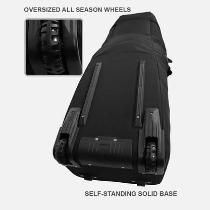 Black travel bag with oversized all-season wheels and self-standing solid base on a white background.