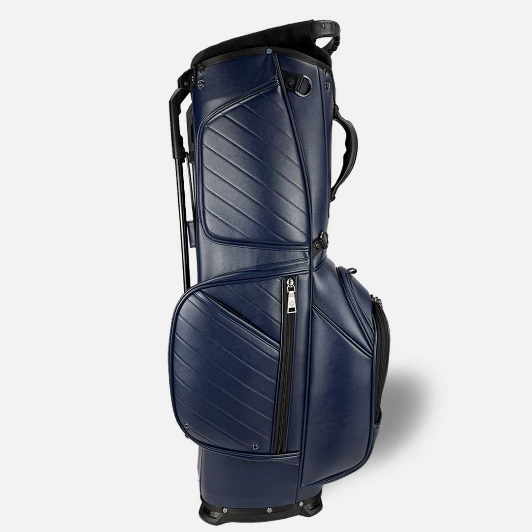 Navy blue golf bag with black accents on a white background