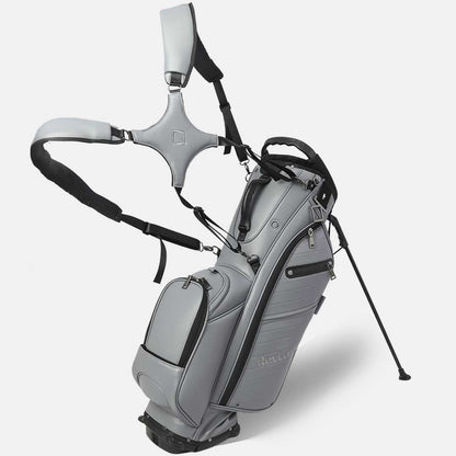 Gray golf bag with stand and club head cover on a white background