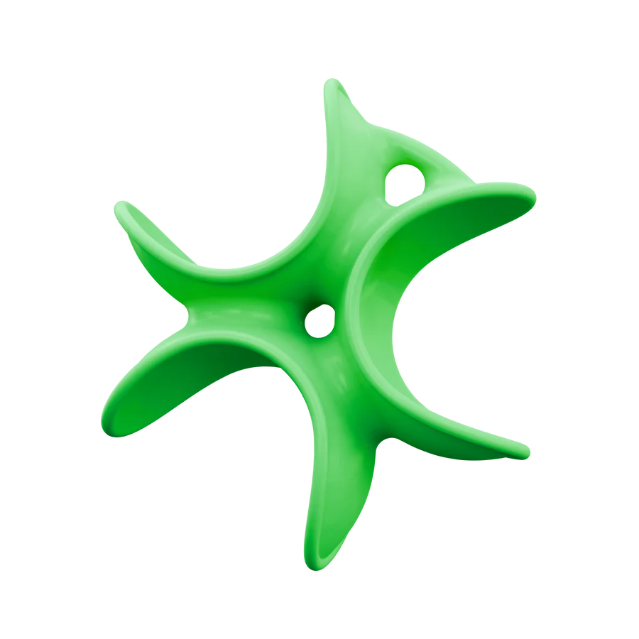 Green plastic star-shaped object on a white background