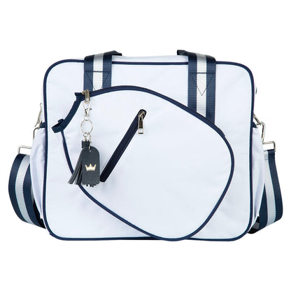 White and navy striped bag with a keychain on a white background