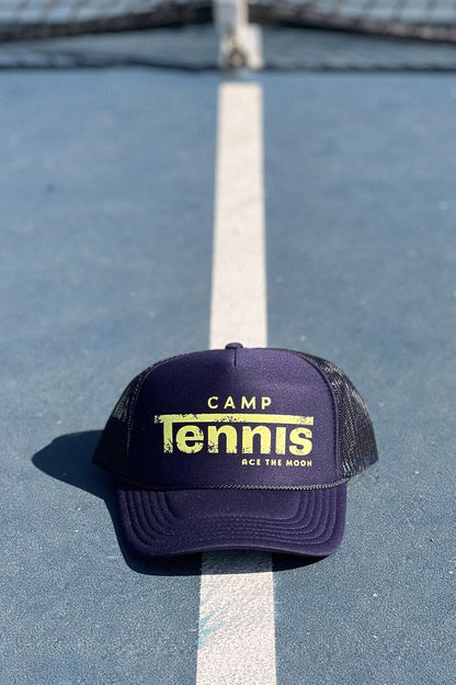 Navy blue cap with 'Camp Tennis' text on a tennis court
