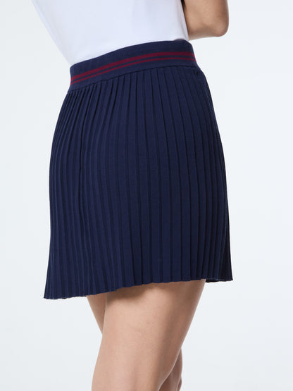 Navy pleated skirt with a red band on a white background