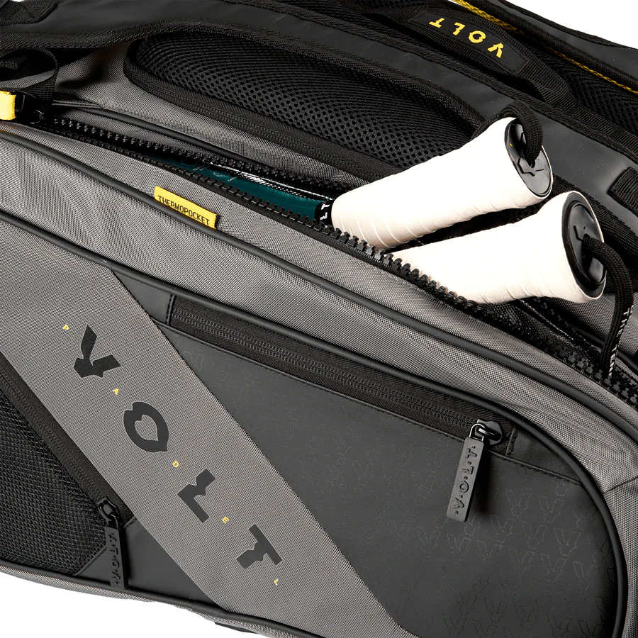 Gray Volt suitcase with a white shoe inside, featuring the Volt logo.