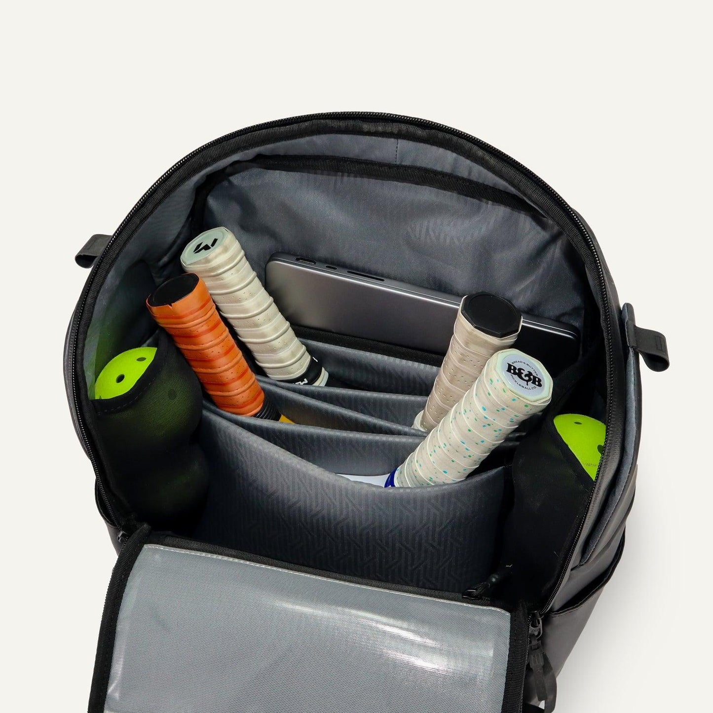 Backpack with tennis rackets and accessories on a white background
