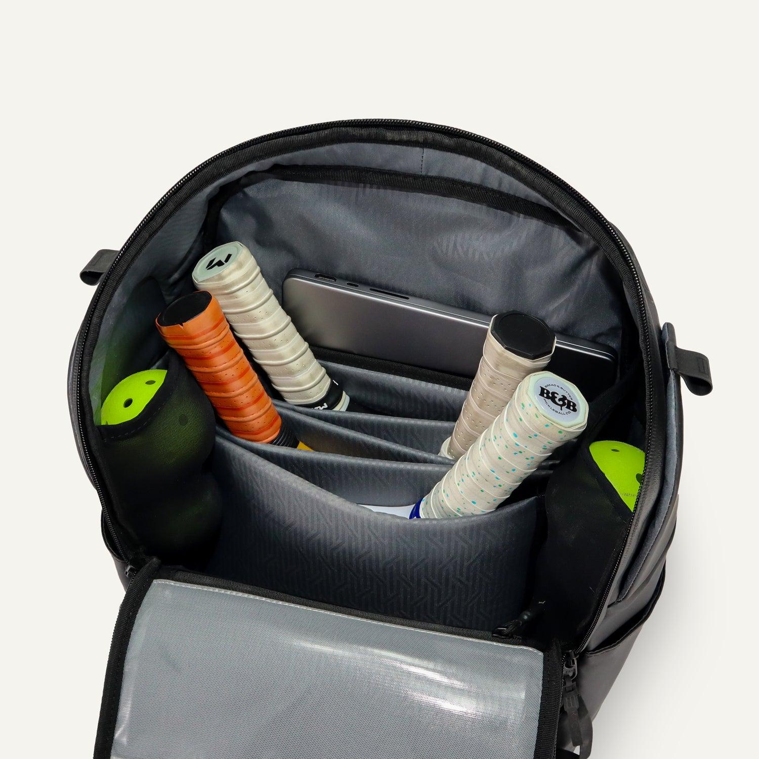 Backpack with tennis rackets and accessories on a white background