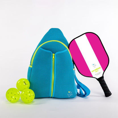 Blue pickleball bag with three yellow balls and a pink and white pickleball paddle on a light gray background