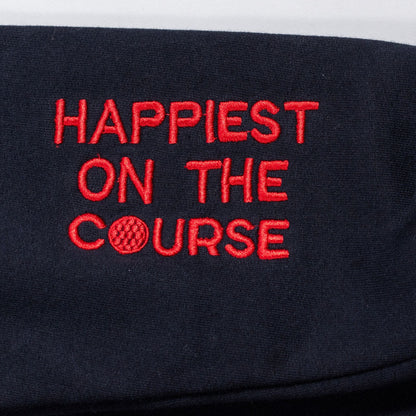 Black headband with red embroidered text 'Happiest on the Course' on a white background