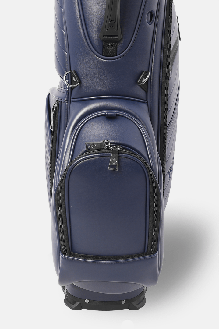 Navy blue golf bag with black accents on a white background