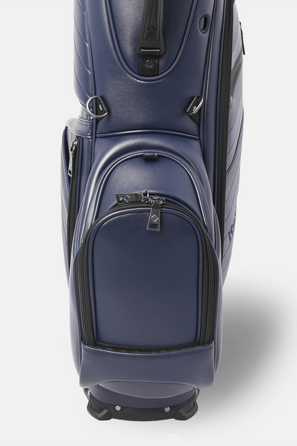 Navy blue golf bag with black accents on a white background