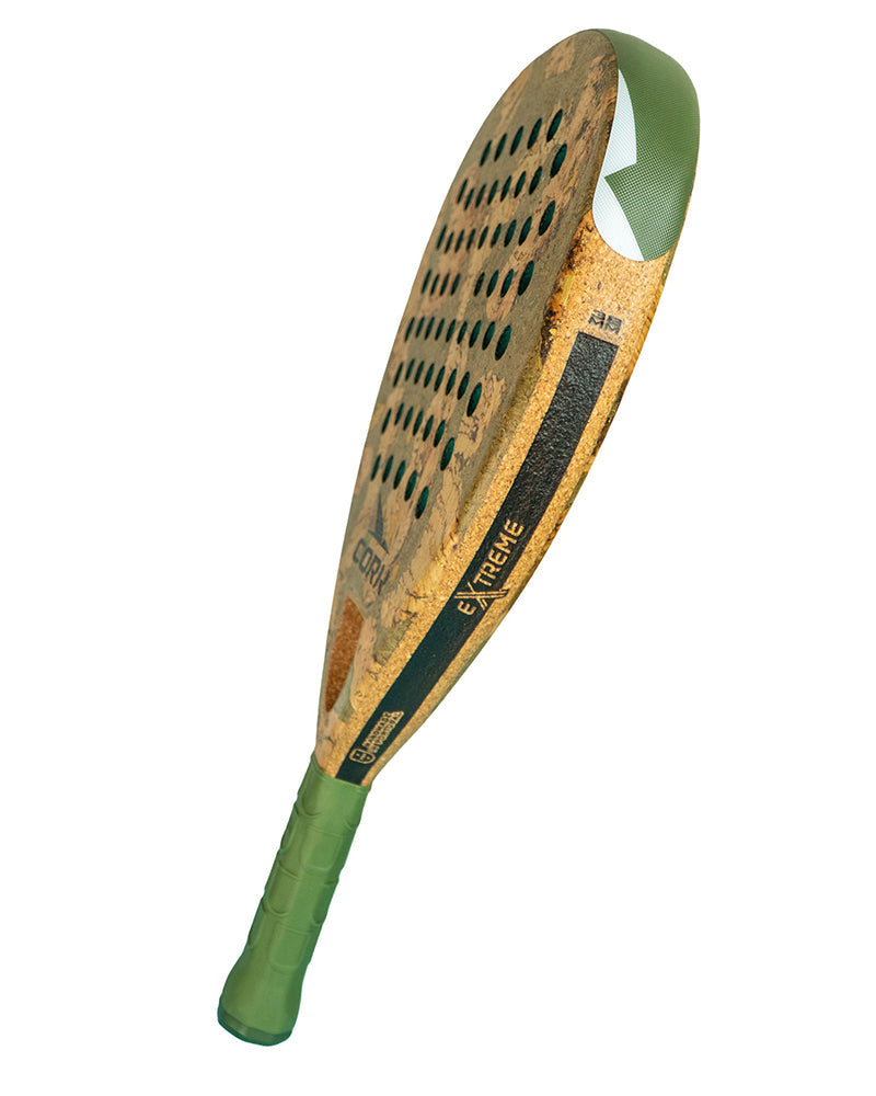 Paddle with green handle and brown surface on a white background