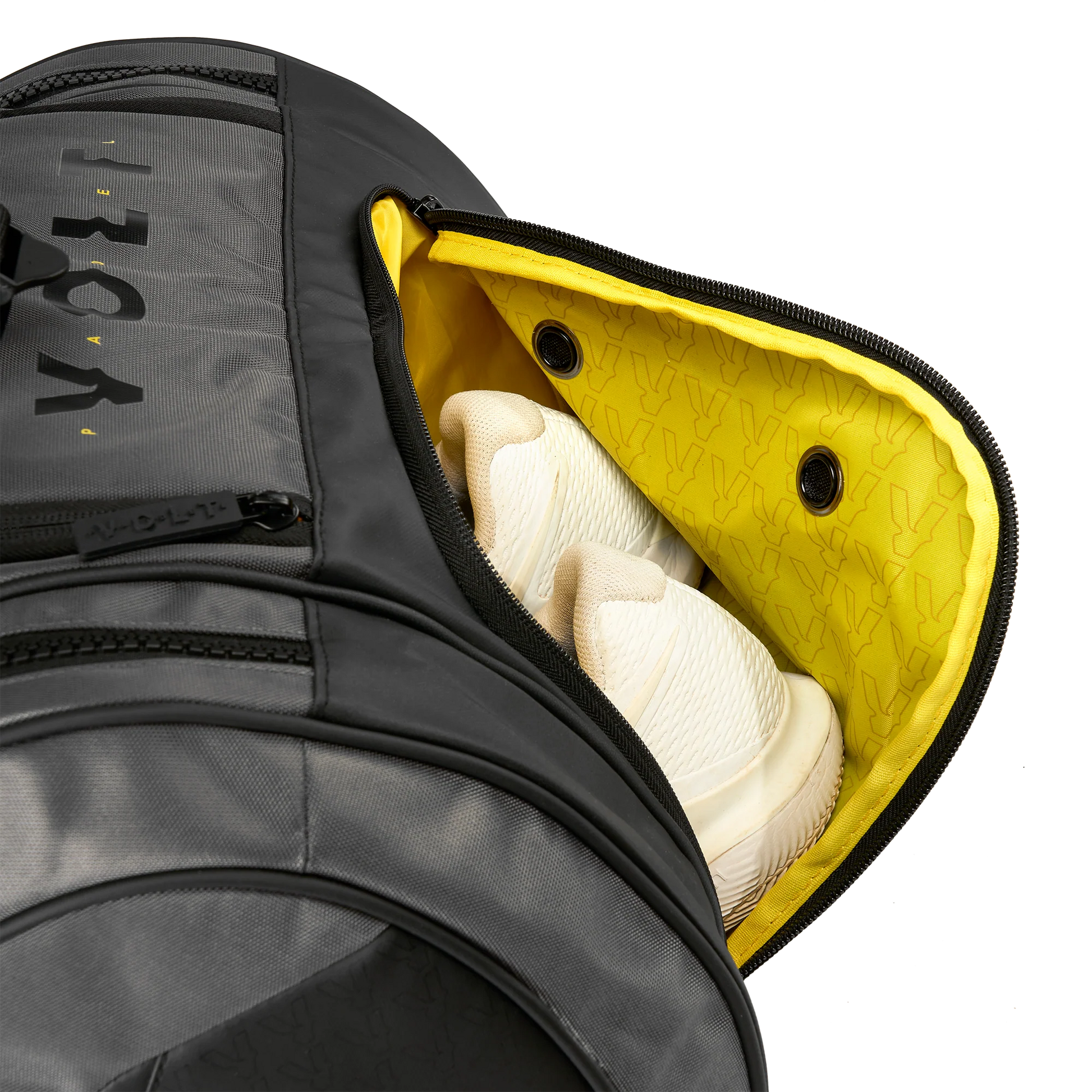 Gray guitar case with a yellow interior, showing a white guitar inside.