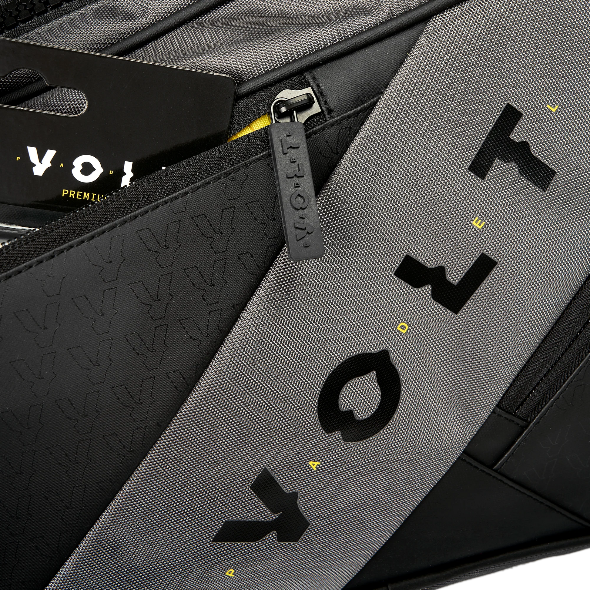 Close-up of a gray and black bag with 'Voy' branding.