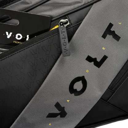 Close-up of a gray and black bag with 'Voy' branding.