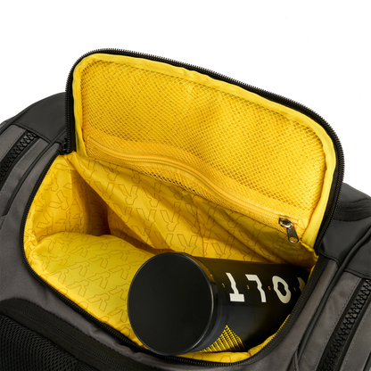 Gray backpack with yellow interior showing a black cylindrical object with '170' printed on it.